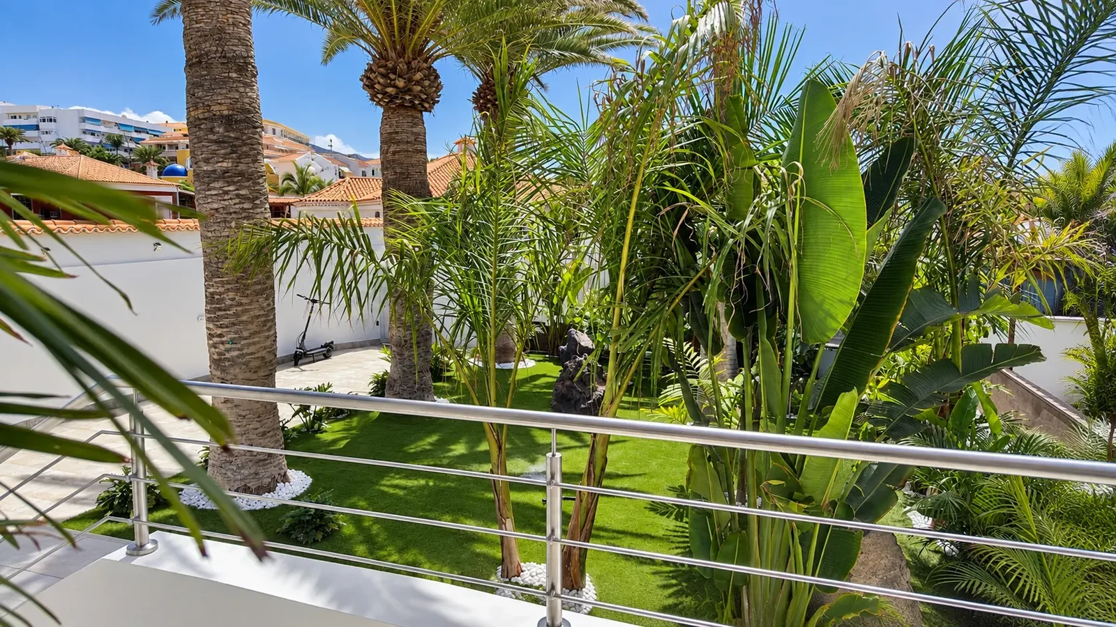 Tropical garden with palms and lawn at Villa White Octopus, Tenerife