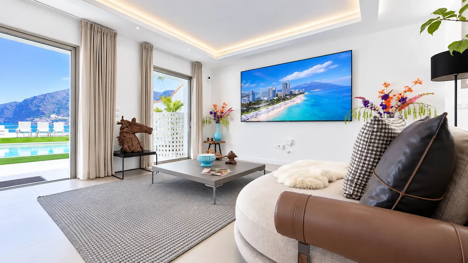 Living room with television and direct pool access at Villa White Octopus, Tenerife