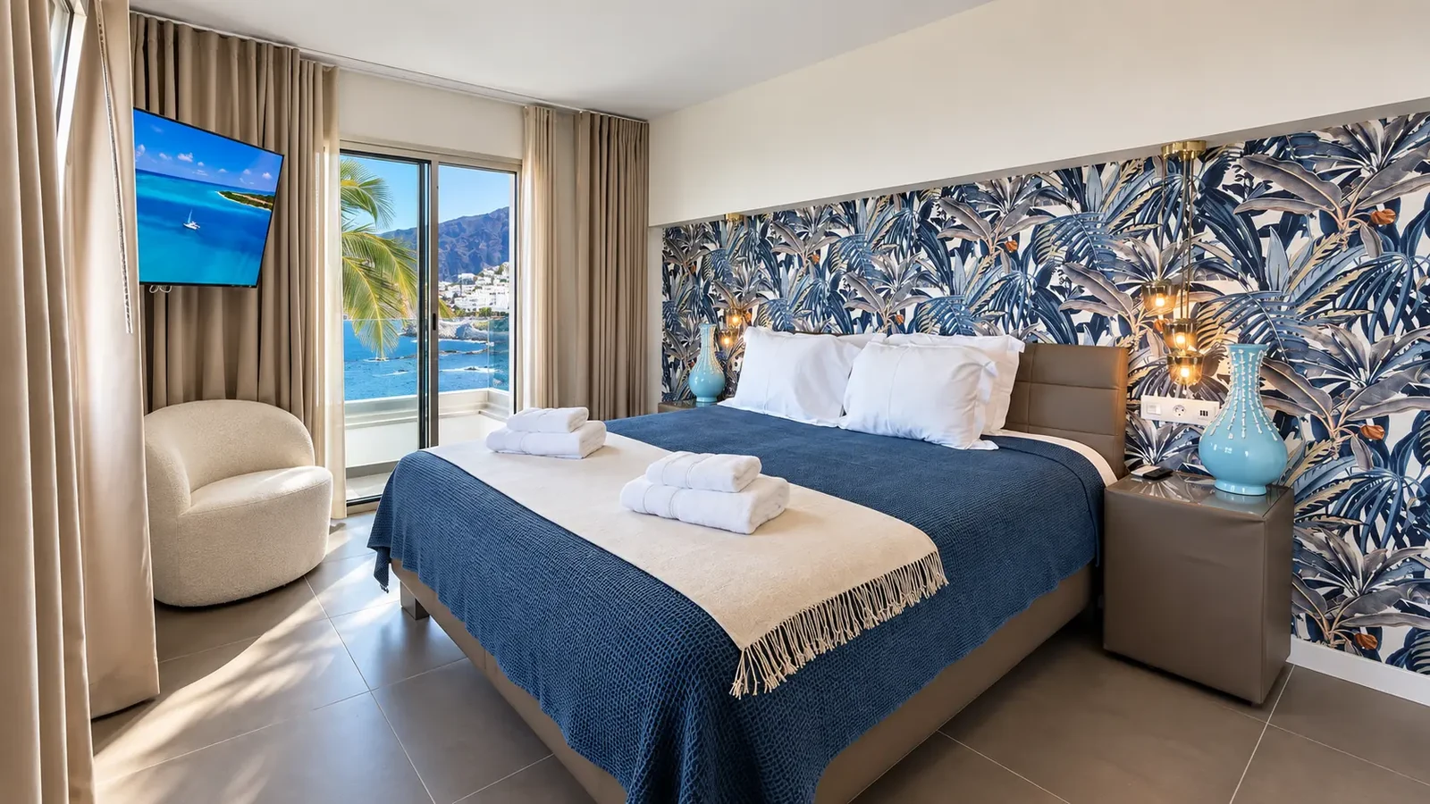 Blue-toned bedroom with tropical wallpaper and Atlantic Ocean view at Villa White Octopus